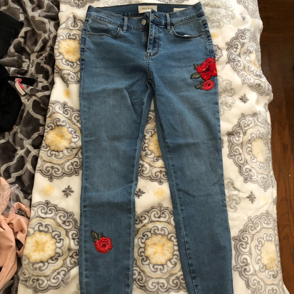 Dark wash jeans with flower detailing